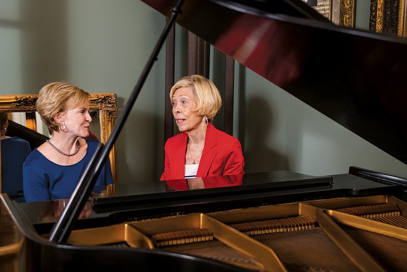 Camille Talburt, left, the first president of the Russellville Symphony Guild, sits at the piano in her home and talks with current president Ann Squyres. Talburt was one of the women who founded the guild 25 years ago to support the Arkansas Symphony Orchestra. Talburt said the Russellville group is one of only three symphony guilds in Arkansas.