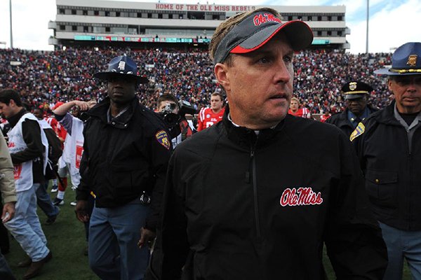 Ole Miss Head Coach Hugh Freeze looks for coaches and players after the game Saturday, Nov. 9, 2013, after Ole Miss beat Arkansas, 34-24, at Vaught-Hemingway Stadium in Oxford, Miss.