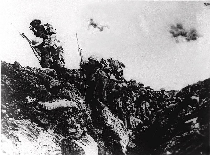 FILE--U.S. troops of Zero Hour Company go over the top during trench warfare at an unidentified battlefield in Europe during World War I.  The first world war was triggered June 28, 1914 when Archduke Franz Ferdinand of Austria and his wife were assassinated in Sarajevo, Bosnia, setting off a chain of events that would lead the United States to declare war on April 6, 1917 to make the world "safe for democracy." More than nine million people died, many of them in the trenches, before Armistice Day, Nov.11, 1918.(AP Photo)