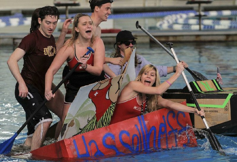 Arkansas Democrat-Gazette/BENJAMIN KRAIN --3/7/14--
UALR lifeguards, from left, Alex Hall, Meagan Tate, Nate Carr, Adrian Hubbard and Lauren Farrell collide cardboard boats as they try to stay afloat during the the UALR Homecoming Great Cardboard Boat Regatta on Friday. Students representing campus organizations competed for various awards during the competition. 
MORE PHOTOS ONLINE -- FOCUS GALLERY