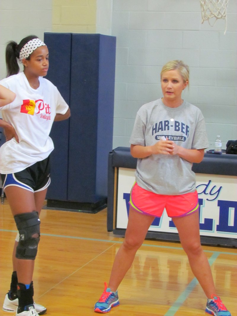 STAFF PHOTO RICK FIRES Shyrah Schisler, Springdale Har-Ber coach, talks with her players Wednesday during volleyball practice. Schisler coached Shiloh Christian to a final four appearance last year in Class 5A.