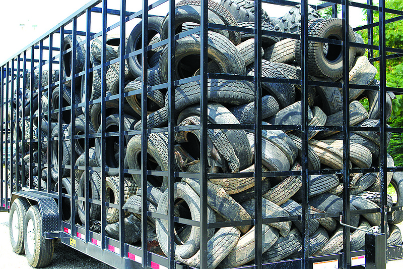 The Sentinel-Record/Richard Rasmussen OLD TIRES: A load of tires is ready for pickup Wednesday at Arkansas Tire on Golf Links Road. It will be one of five designated collection sites in the county after the landfill stops collecting used tires next month.