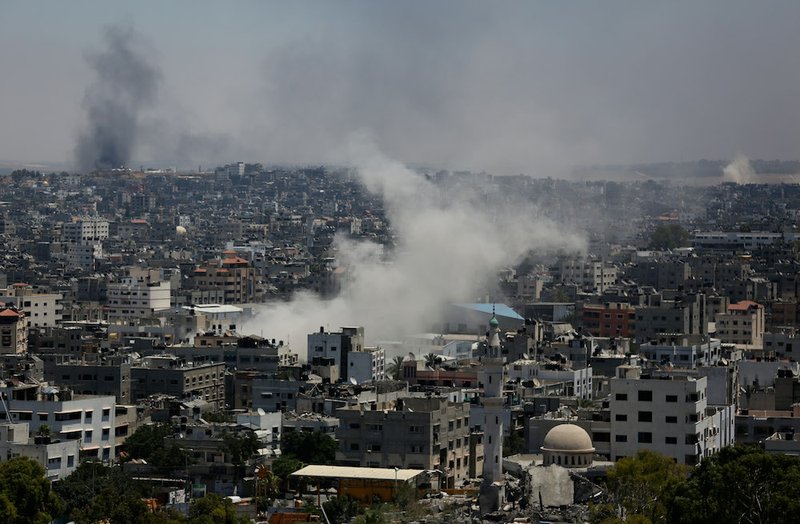 Smoke from an Israeli strike rises over Gaza City on Thursday, July 24, 2014. Israeli tanks and warplanes bombarded the Gaza Strip on Thursday as Hamas militants stuck to their demand for the lifting of an Israeli and Egyptian blockade in the face of U.S. efforts to reach a cease-fire. 