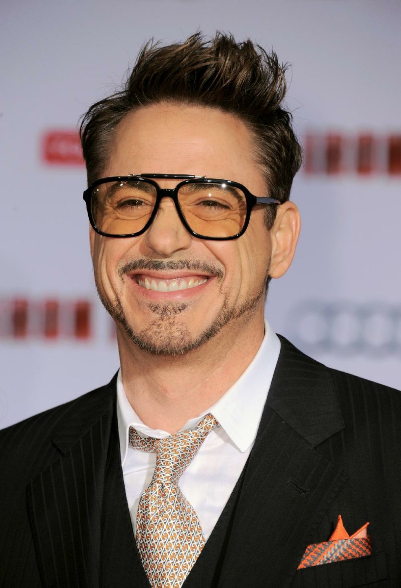 FILE - In this April 24, 2013 file photo, actor Robert Downey Jr. arrives at the world premiere of "Marvel's Iron Man 3" at the El Capitan Theatre, in Los Angeles. The Toronto Film Festival unveiled a star-heavy lineup amid increased festival jockeying for the most plum premieres of Hollywoods fall season. Torontos slate, announced in a press conference Tuesday, July 22, 2014, in Toronto, features anticipated performances from Denzel Washington, Reese Witherspoon, Downey Jr. and Benedict Cumberbatch, as well as films from directors like Chris Rock, Noah Baumbach and Jon Stewart, making his debut behind the camera. (Photo by Jordan Strauss/Invision/AP, file)