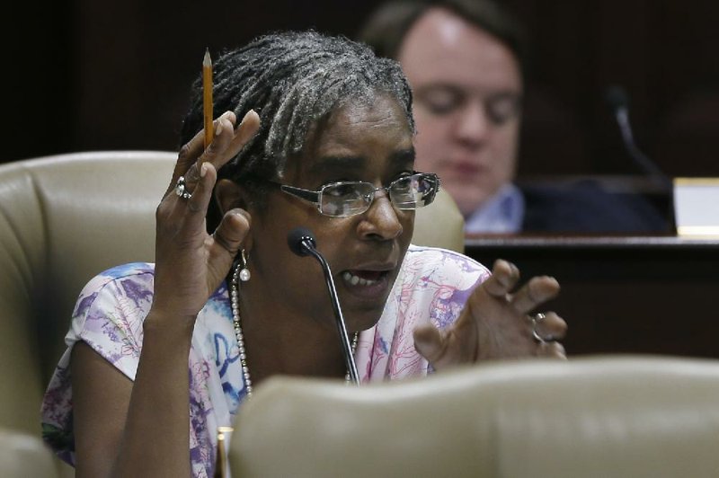 Sen. Stephanie Flowers, D-Pine Bluff, asks a question  during a joint meeting of the House and Senate Public Health, Welfare and Labor Committees in Little Rock, Ark., Thursday, July 24, 2014. (AP Photo)