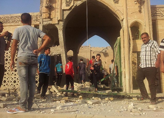 People inspect the destroyed Mosque of The Prophet Younis, or Jonah, in Mosul, 225 miles (360 kilometers) northwest of Baghdad, Iraq, Thursday, July 24, 2014. The revered Muslim shrine was destroyed on Thursday by militants who overran the city in June and imposed their harsh interpretation of Islamic law. The mosque was built on an archaeological site dating back to 8th century BC, and is said to be the burial place of the prophet, who in stories from both the Bible and Quran is swallowed by a whale. (AP Photo)