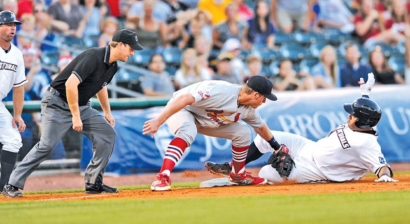  STAFF PHOTO ANDY SHUPE Max Ramirez, right, Northwest Arkansas Naturals first baseman, slides in safely ahead of the tag by Springfield Cardinals third baseman Patrick Wisdon after hitting an RBI triple during the fourth inning Thursday at Arvest Ballpark in Springdale.