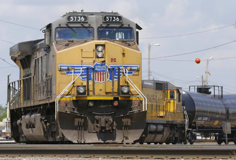 Union Pacific locomotives pull a train in Council Bluffs, Iowa, last month. The railroad said Thursday that its quarterly revenue rose 10 percent to $6.02 billion.