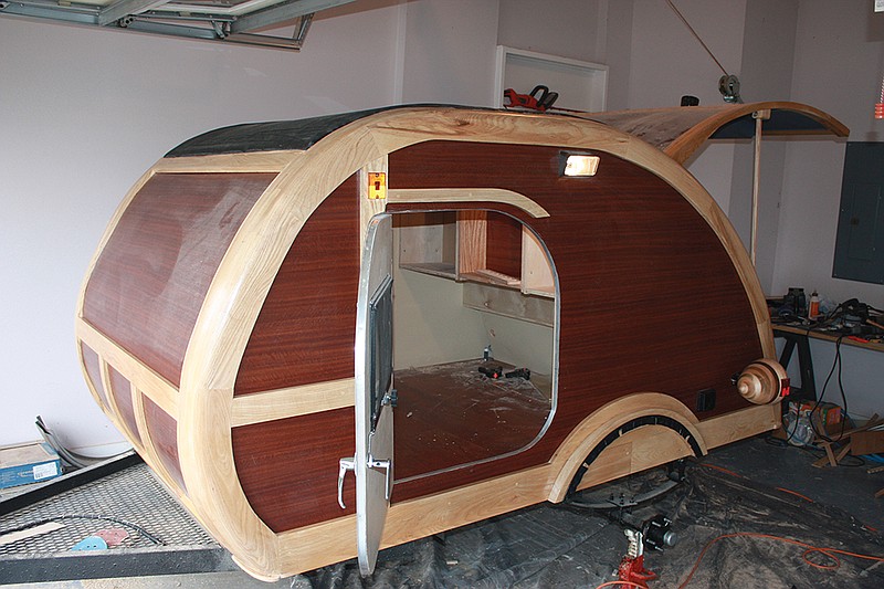 The Sentinel-Record/Jeff Smith NEARLY FINISHED: A small punch list is all that remains to finish a small camper trailer built by members of the Village Woodworkers. Proceeds from the trailer&#8217;s sale will go toward building wooden toys for children during Christmas.