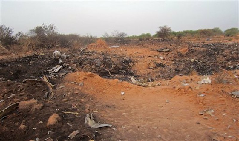 This photo provided on Friday, July 25, 2014, by the Burkina Faso Military shows the site of the plane crash in Mali. French soldiers secured a black box from the Air Algerie wreckage site in a desolate region of restive northern Mali on Friday, the French president said.