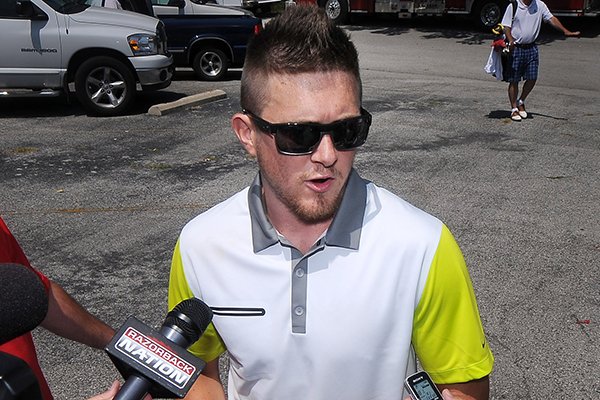 Rotnei Clarke, former Arkansas basketball player, speaks to the media prior to the George Billingsley NWA Razorback Club Celebrity Scramble golf tournament at the Kingsdale Golf Complex in Bella Vista on Friday, July 25, 2014. 