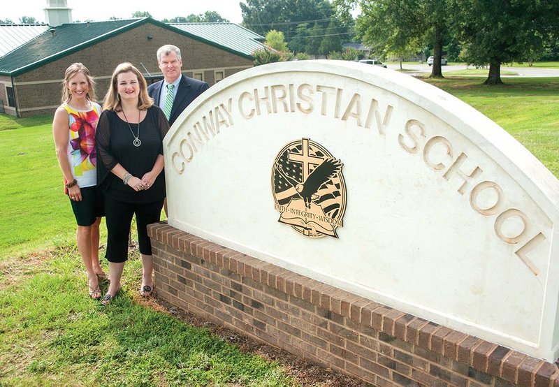 Parent Shannon Milam, from left, and Kirsten Kravitz stand with Conway Christian School President and CEO Richard Henley. The women are members of the Committee for Options in Education, which is exploring the possibility of a K-12 school in Conway for developmentally disabled children. They have asked Conway Christian School to partner in some way with the proposed school.