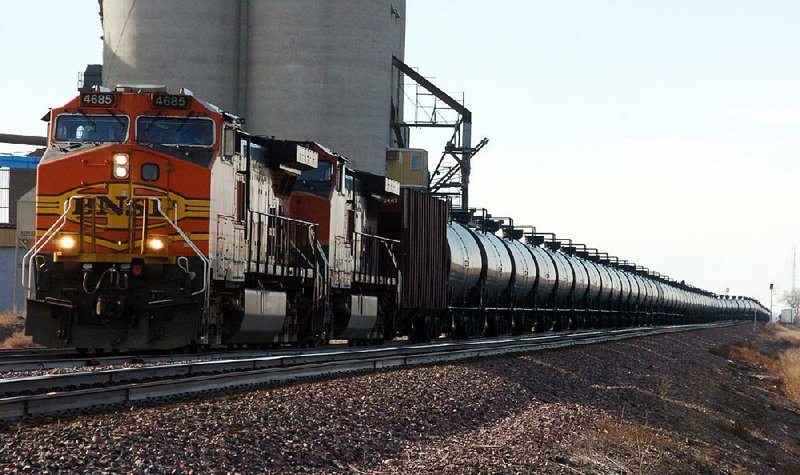 A Burlington Northern Santa Fe Railway train hauls crude oil near Wolf Point, Mont., in November. Crude oil from the Bakken shale region of North Dakota and Montana is making Albany, N.Y., a new energy hub.