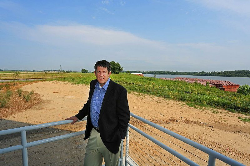 Bryan Day, new executive director of the Little Rock Port Authority, stands outside his office at the nearly completed headquarters for the port authority along the Arkansas River