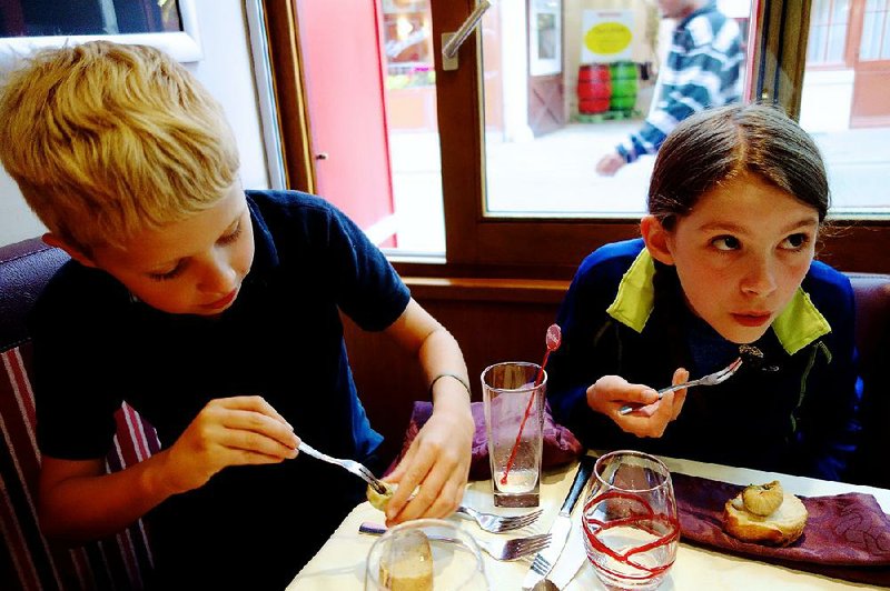 Travelers of all ages (like these young ones trying snails for the first time) can reach new gastronomic heights in France.