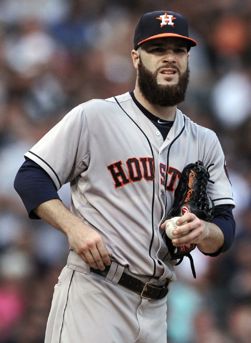 Houston Astros starting pitcher Dallas Keuchel reacts to giving up two runs during the third inning of a baseball game against the Chicago White Sox in Chicago, Saturday, July 19, 2014. (AP Photo/Paul Beaty)
