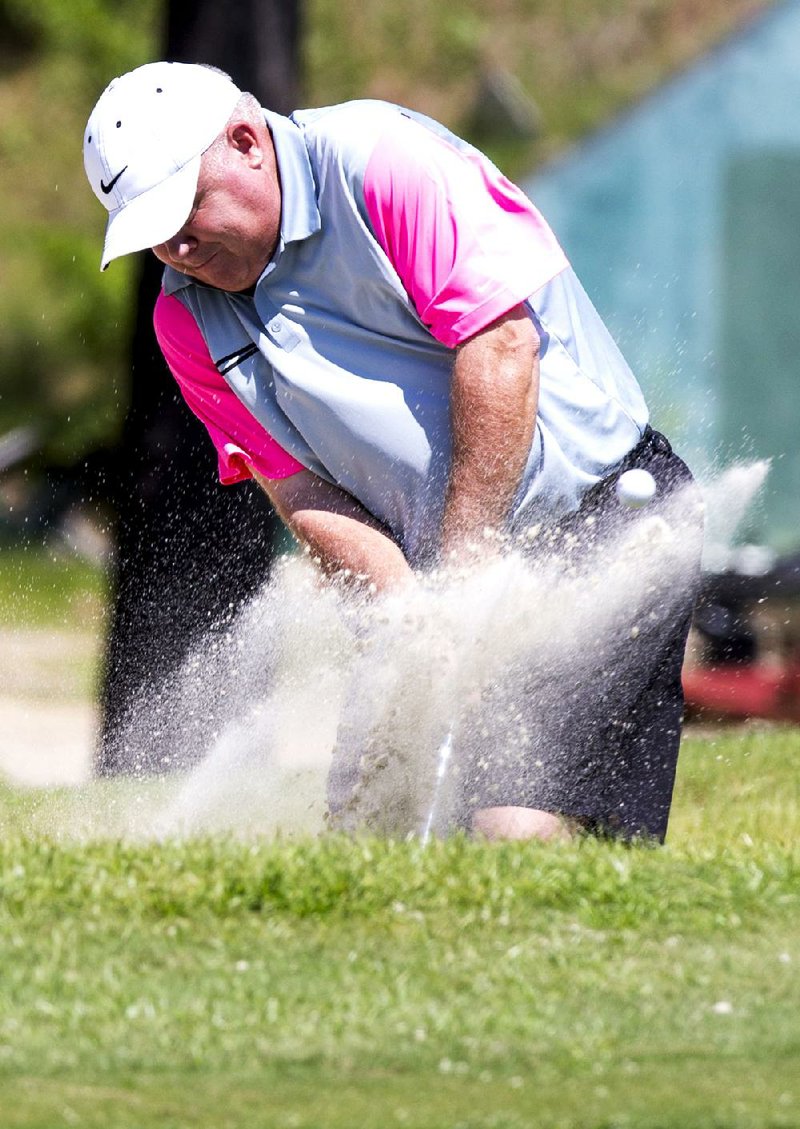 Arkansas Democrat-Gazette/Melissa Sue Gerrits - 07/25/2014 - Tracy Harris hits his ball out of a sand trap on the 7th hole during the first round of the Maumelle Classic July 25, 2014 at the Maumelle Country Club. 