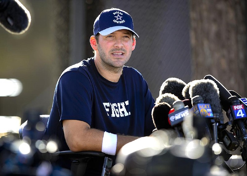 Dallas Cowboys quarterback Tony Romo gives a news conference to talk about his recovery from back surgery at the end of Dallas Cowboy's training camp, Thursday, July 24, 2014, in Oxnard, Calif. (AP Photo/Gus Ruelas)