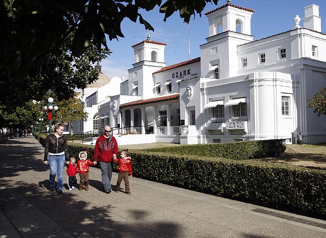 Rachel and Brian Kinney walk with their children Brian Jr. (second from left), Nevaeh (center) and Kierstin (right) along Bath House Row in Hot Springs in 2010. A National Park Service economic impact report released this month said Hot Springs National Park is the most visited national park in the state.