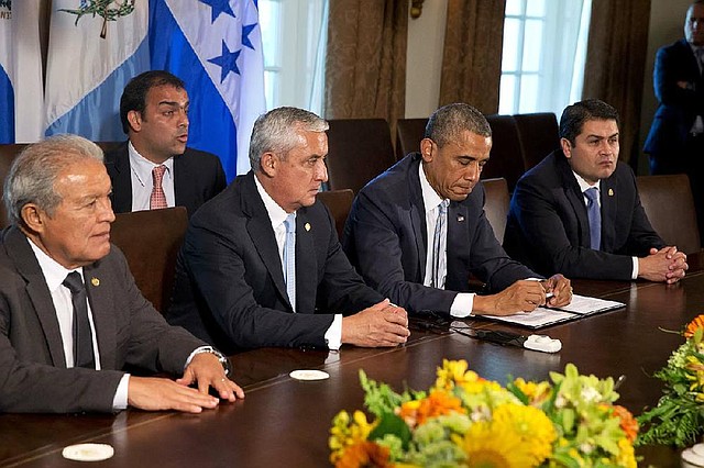 El Salvador's President Salvador Sanchez Ceren, left, Guatemala's President Otto Perez Molina, U.S. President Barack Obama, and Honduran President Juan Hernandez, listen to Spanish translation of Obama's remarks to the media after they met to discuss Central American immigration and the border crisis in the Cabinet Room of the White House Friday, July 25, 2014, in Washington. (AP Photo)