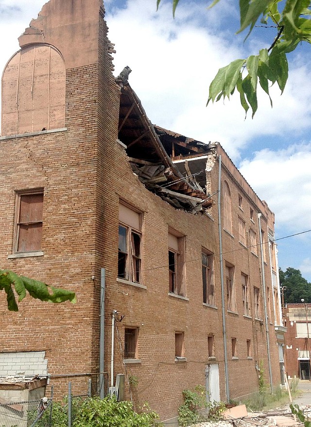 The top floor at the rear of the vacant, three-story building at 602 Main St. in Pine Bluff collapsed Friday prompting authorities to close off the street between Sixth and Eighth avenues as a safety precaution.