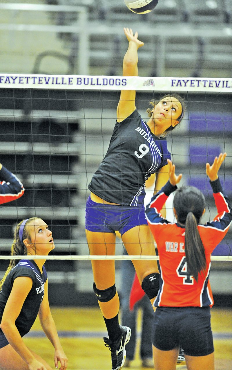 STAFF PHOTO ANDY SHUPE Olivia Thomas, left, Fayetteville senior, and Ellie Breden are two of six returning varsity players for the Lady Bulldogs volleyball team this season.