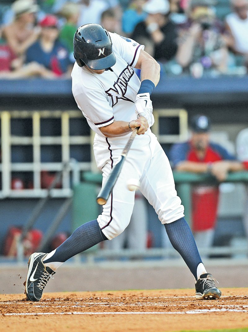 STAFF PHOTO SAMANTHA BAKER @NWASAMANTHA Hunter Dozier of the Northwest Arkansas Naturals swings at a pitch Friday at Arvest Ballpark in Springdale during the game against the Springfield Cardinals.