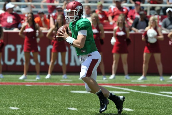 Arkansas quarterback Rafe Peavey scrambles out of the pocket during the Red-White game April 30, 2014, at Razorback Stadium in Fayetteville.