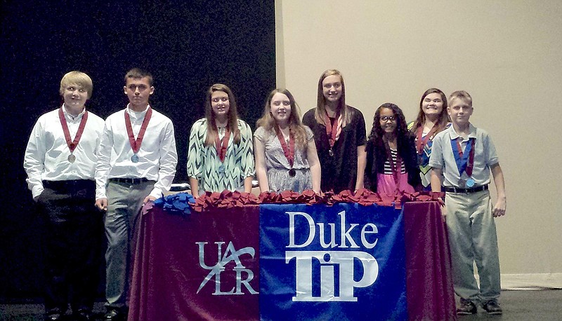 Submitted photo Eight students at Lake Hamilton Middle School attended the Duke Talent Identification Program State Recognition program on May 15 at the University of Arkansas at Little Rock. Two of the students, Spencer Fellenz and Lauren McMillan, also received Grand Recognition and were invited to attend the national level ceremony at Duke University in Durham, N.C. A total of 21,775 students from Duke TIP&#8217;s 16-state region scored well enough to be invited to state recognition ceremonies, including 458 of the 961 who tested in Arkansas. The students scored 21 or greater on at least one ACT area of English, math, reading or science. Students, from left, are Tyler Dickson, Hayden Dukes, Kamryn Knox, McMillan, Kit Adderholt, Reyona Bennett, Molly Blancaflor and Fellenz.