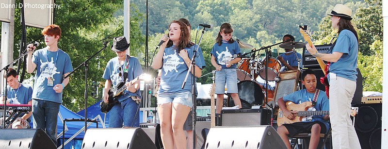 Submitted photo BLUES SHOWCASE: Participants in the Blues in the Schools program, sponsored by Spa City Blues Society, rock the Hot Springs Blues Festival in 2013 with, at right, performer and teacher Heather Crosse.