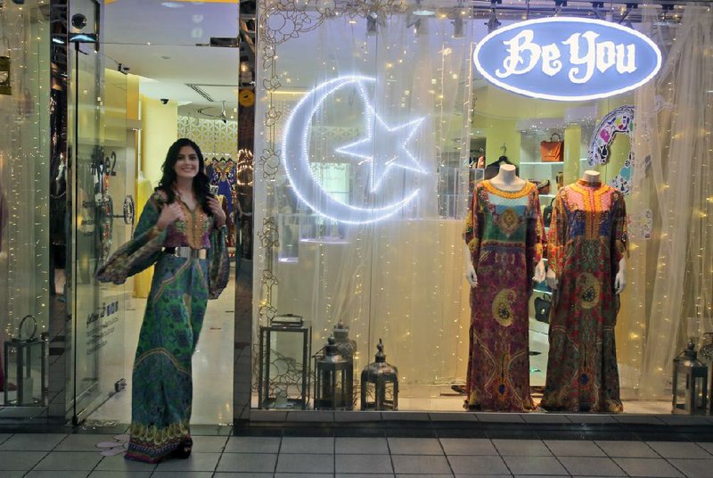 Tamara Al Gabbani, the designer of the DKNY Ramadan collection, leaves a boutique in Dubai, United Arab Emirates, earlier this month where some of her designs were being offered for sale to wealthy Arabs on the occasion of the Ramadan holiday.