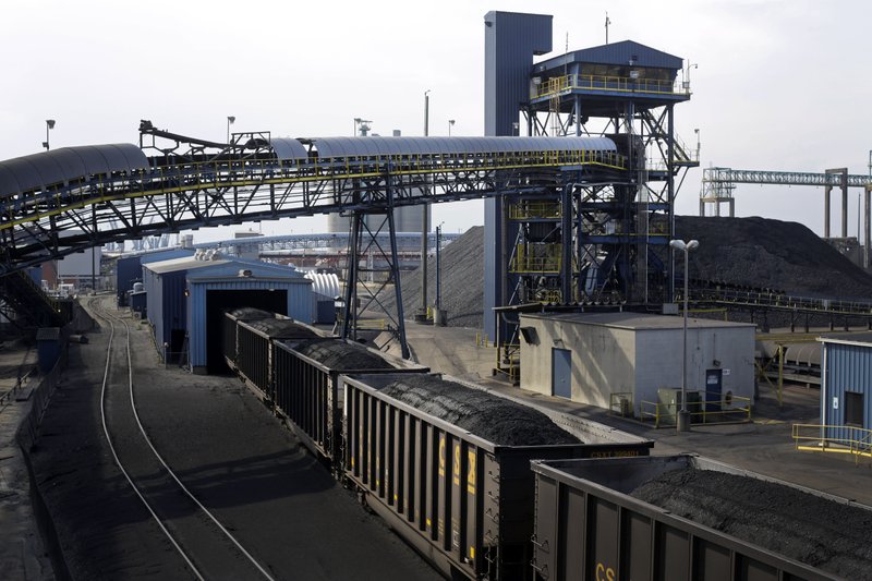 In this May 22, 2014, photo, train cars containing coal roll into an unloading facility at Dominion Terminal Associates' coal terminal in Newport News, Va. As the Obama administration weans the U.S. off dirty fuels blamed for global warming, energy companies have been sending more of Americas unwanted energy leftovers to other parts of the world, where they could create even more pollution. With companies looking to double Americas coal exports, the nations growing position in the global energy trade could make global warming worse, fueling the worlds demand for coal when many experts say most fossil fuels should remain in the ground to avert the most disastrous effects of climate change.