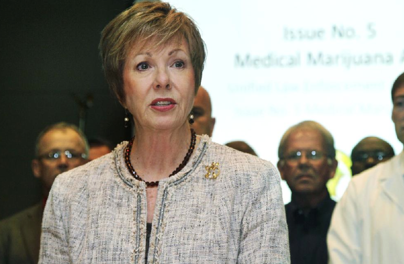 FILE: In this Oct. 20, 2012 file photo, State Drug Director Fran Flener speaks in Little Rock with several representatives of groups urging voters to reject the Medical Marijuana Act.