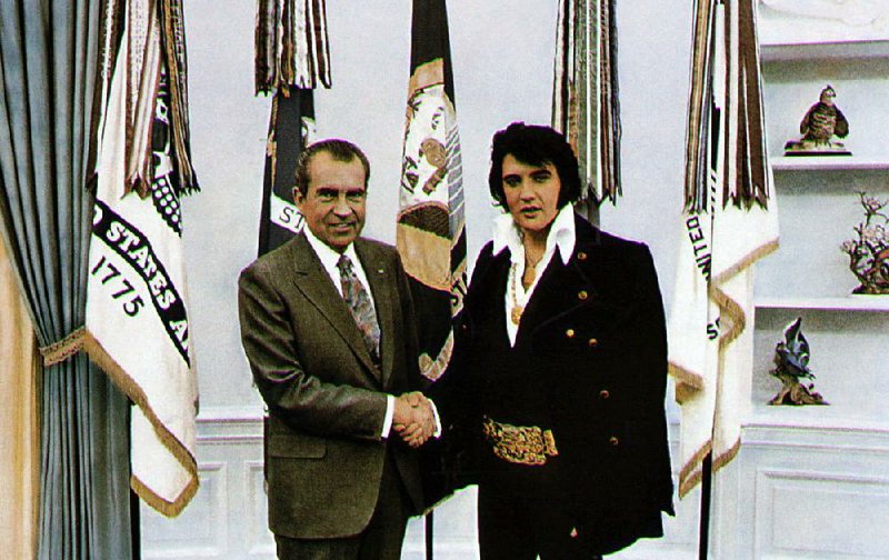 **FILE** This  handout file photo shows President Richard Nixon, left, meeting with Elvis Presley on Dec. 21, 1970, in Washington. The meeting between two of the most improbable cultural icons of the 1970's lasted all of 30 minutes, but it has fascinated the nation for years. Now, on what would be the King's 72nd birthday, the Richard Nixon Presidential Library & Birthplace is giving the curious public a good, long look at the relics of the coming together of The King and The President - and it's got Elvis fans all shook up. (AP Photo/White House Photo, File)
