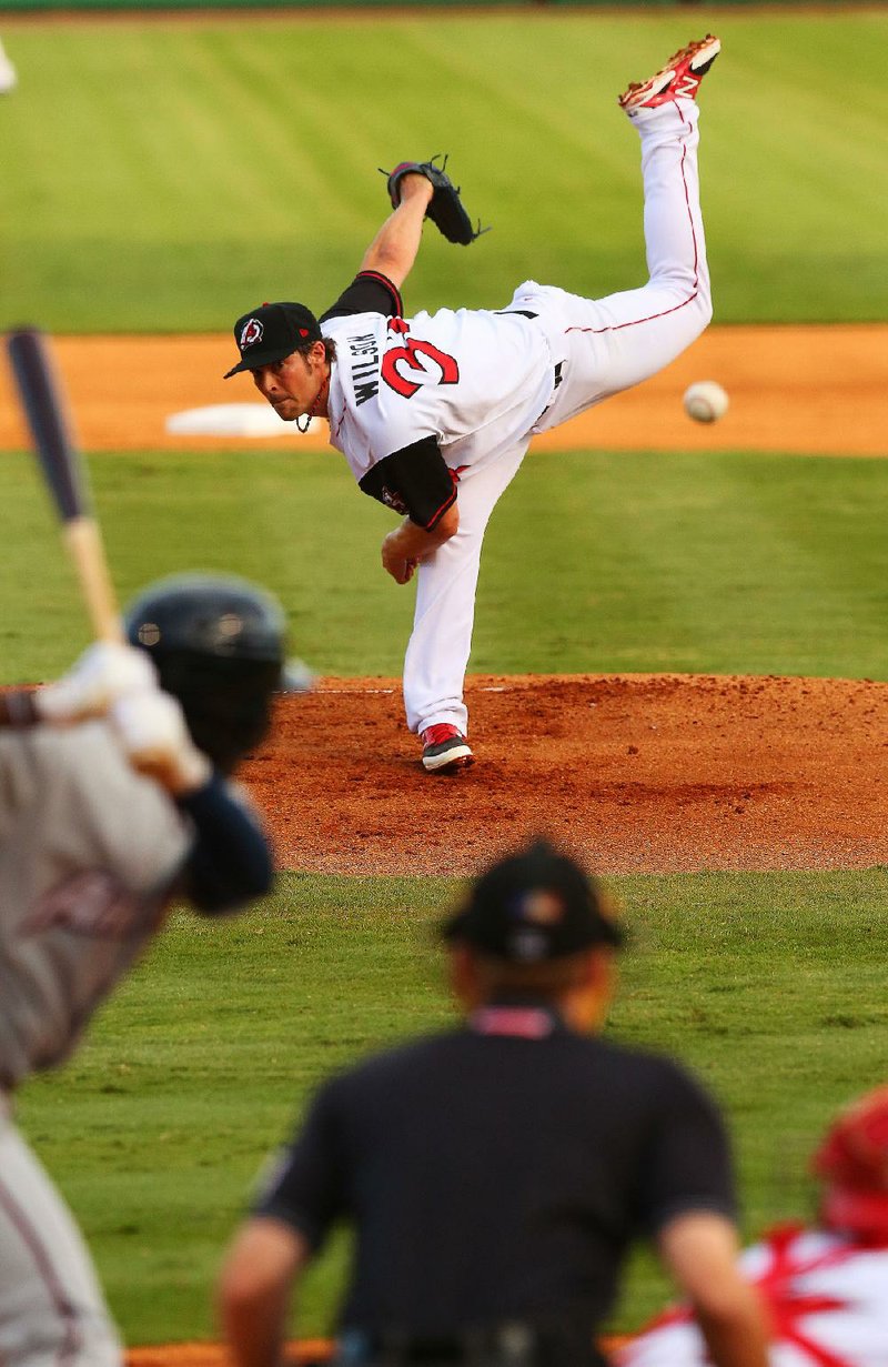 7/28/14
Arkansas Democrat-Gazette/STEPHEN B. THORNTON
Los Angels Angel pitcher CJ Wilson pitches for the Arkansas Travelers during the first inning of their game Monday night in North Little Rock.