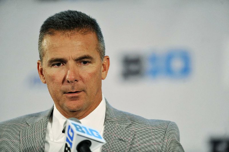 Ohio State head coach Urban Meyer talks to the media during the Big Ten Football Media Day in Chicago, Monday, July 28, 2014. (AP Photo/Paul Beaty)