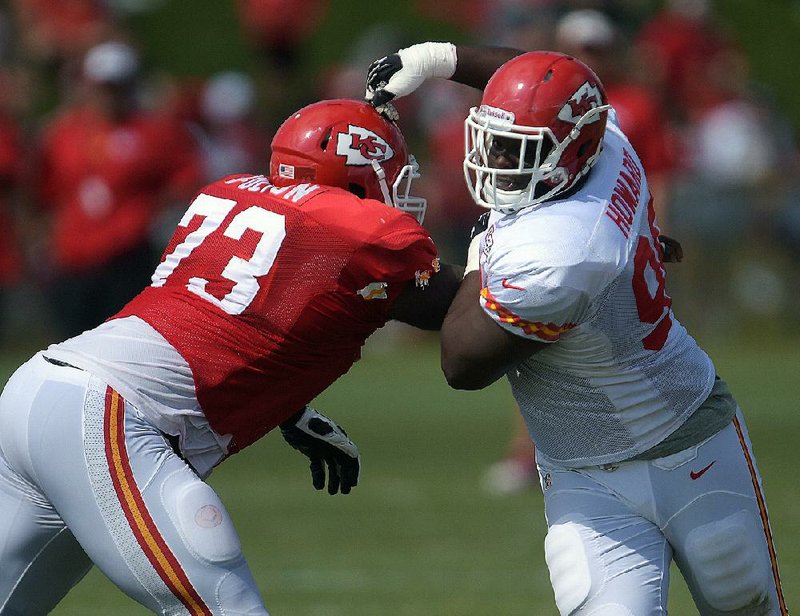 Kansas City Chiefs defensive tackle Jaye Howard pushes aside guard Zach Fulton (73) during a drill at an NFL football training camp Monday, July 28, 2014, on the Missouri Western State University campus in St. Joseph, Mo. (AP Photo/The St. Joseph News-Press, Todd Weddle)