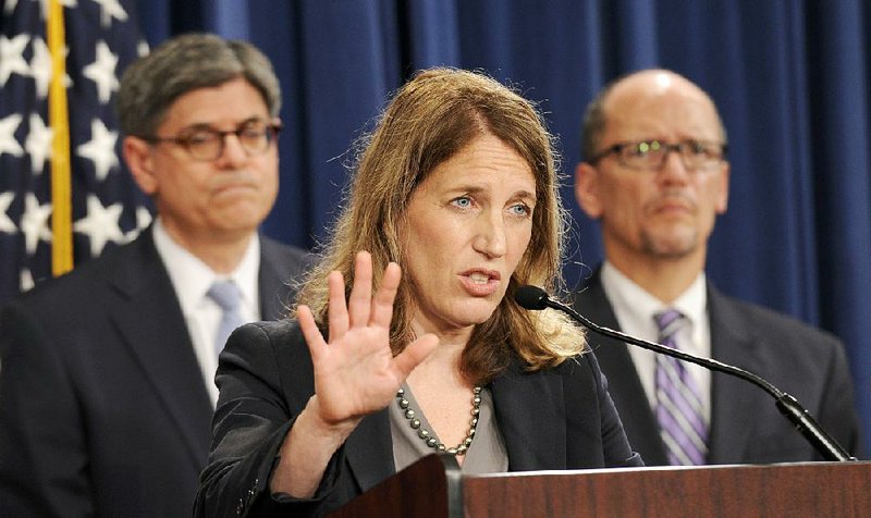 Health and Human Services Secretary Sylvia Burwell, center, flanked by Treasury Secretary and Managing Trustee Jacob J. Lew, left, and Labor Secretary Thomas E. Perez, speaks at a news conference at the Treasury Department in Washington, Monday, July 28, 2014, to discuss the release of the annual Trustees Reports. (AP Photo/Susan Walsh)