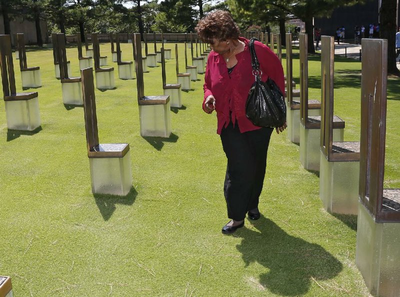 Jannie Coverdale walks among the Field of Chairs at the Oklahoma City Bombing Memorial in Oklahoma City, on Friday, looking for the chairs of her two grandchildren, who were killed in the blast. Coverdale said she is hopeful that a coming trial in Utah will shed light on the bombing.