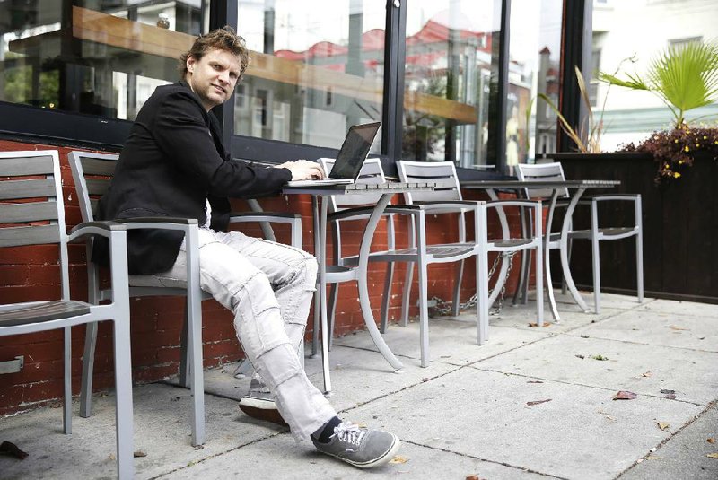Gerry Kelly, a Bubblews user, sits near his home in San Francisco earlier this month. Bubblews is a social network that pays users for posts that attract traffic and advertisers.