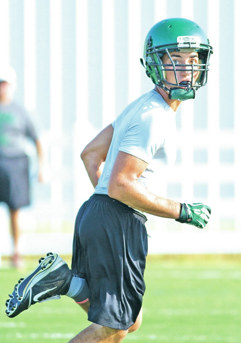 Special to NWA Media David J. Beach Mason Miller of Greenland runs July 21 during a 7-on-7 competition against Siloam Springs at Springdale Har-Ber High School.