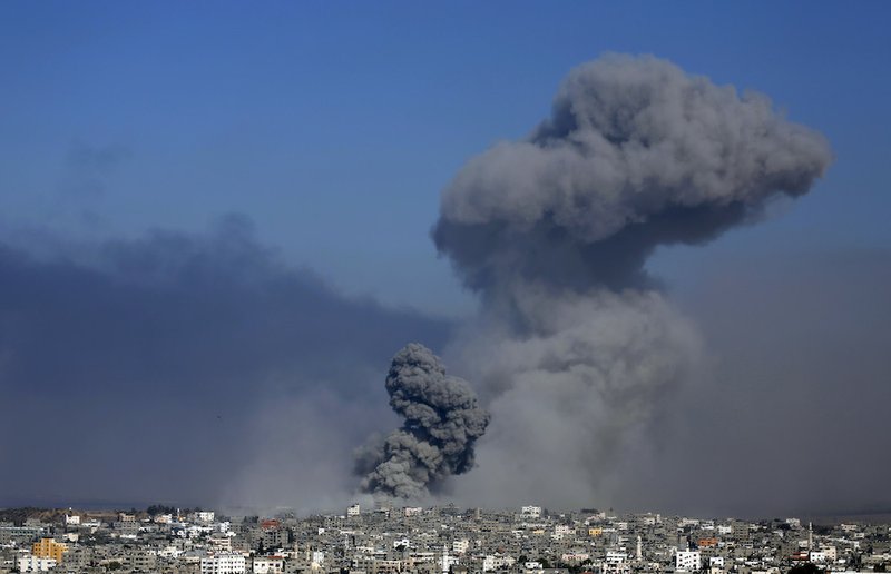 Smoke from the explosion of an Israeli strike rises over Gaza City on Tuesday, July 29, 2014. Israel escalated its military campaign against Hamas on Tuesday, striking symbols of the group's control in Gaza and firing tank shells that shut down the strip's only power plant in the heaviest bombardment in the fighting so far. 