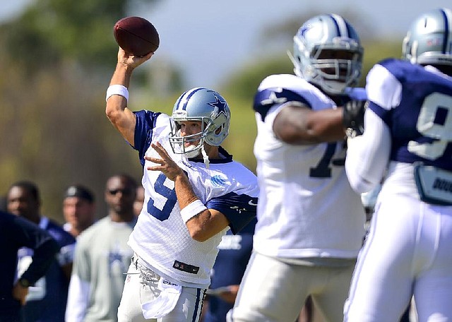 Dallas quarterback Tony Romo (9) was withheld from practice Tuesday after taking part in fullpad workouts last week. Romo is still recovering from back surgery in December.