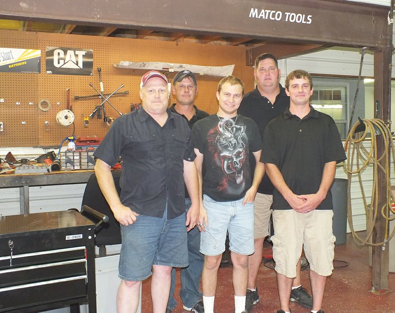 TIMES photograph by Annette Beard The doors of Blackhawk Auto will open Saturday, Aug. 2, for an open house and then on Monday, Aug. 4, for business. Getting ready for the new business are Stanley Sunderman, owner; David Sunderman; and Scott Spivey, mechanic; and back, from left, Jeff Arnold, owner, and Larry Rogers, tire and wheel manager.