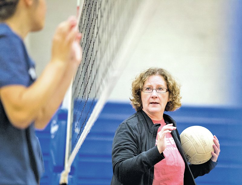  STAFF PHOTO JASON IVESTER Jena Breedlove, Rogers High coach, talks with her players during practice Tuesday at the school.