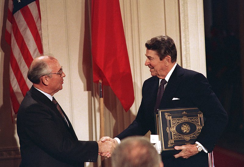 In this Dec. 8, 1997, file photo, U.S. President Ronald Reagan, right, shakes hands with Soviet leader Mikhail Gorbachev after the two leaders signed the Intermediate Range Nuclear Forces Treaty to eliminate intermediate-range missiles during a ceremony in the White House East Room in Washington. In an escalation of tensions, the Obama administration accused Russia on July 28, 2014, of conducting tests in violation of a 1987 nuclear missile treaty, calling the breach "a very serious matter" and going public with allegations that have simmered for some time. The treaty confrontation comes at a highly strained time between President Barack Obama and Russian President Vladimir Putin over Russia's intervention in Ukraine and Russia's grant of asylum to National Security Agency leaker Edward Snowden.