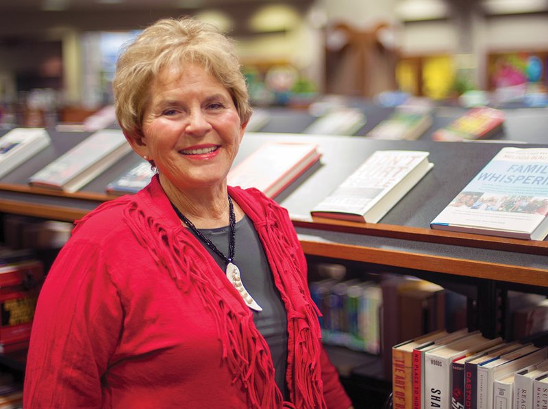 Author Sylvia Dickey Smith talks about her books as she prepares for a class on writing mystery novels that she will conduct at the Garland County Library in Hot Springs.