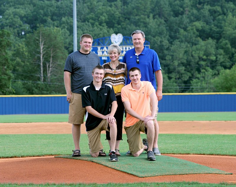 The Sentinel-Record/Mara Kuhn ALL IN THE FAMILY: Susan and Reggie Ritter, back center and right, gather on the Lakeside High School pitching mound with sons Bo, front left, Josh and Zach, back left. Reggie Ritter spent parts of two seasons as a Cleveland Indians reliever, and at least one Ritter son played on a Lakeside team each of the past 13 years.