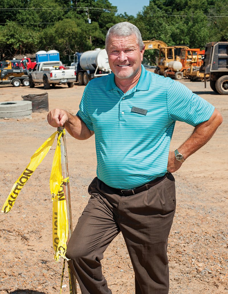 Heber Springs School District Superintendent Russell Hester stands on the site of the performing-arts complex under construction at the high school campus. The building is part of a $12 million construction project that was made possible by a millage increase approved by school-district patrons in 2013.