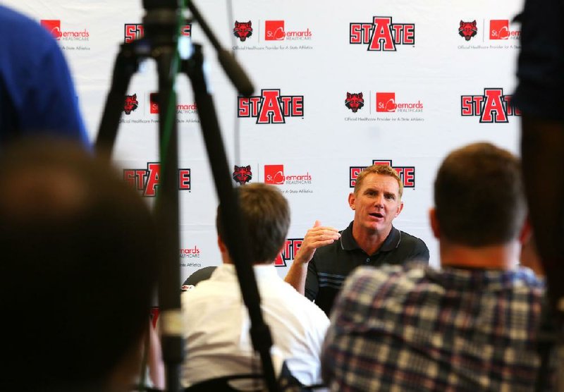 Arkansas State Coach Blake Anderson speaks to members of the media Wednesday in Jonesboro. A former offensive coordinator, Anderson will not be calling offensive plays this year for the fi rst time in eight seasons.